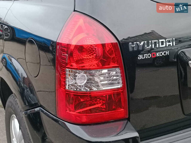 Черный Хендай Туксон, объемом двигателя 2 л и пробегом 192 тыс. км за 7990 $, фото 9 на Automoto.ua