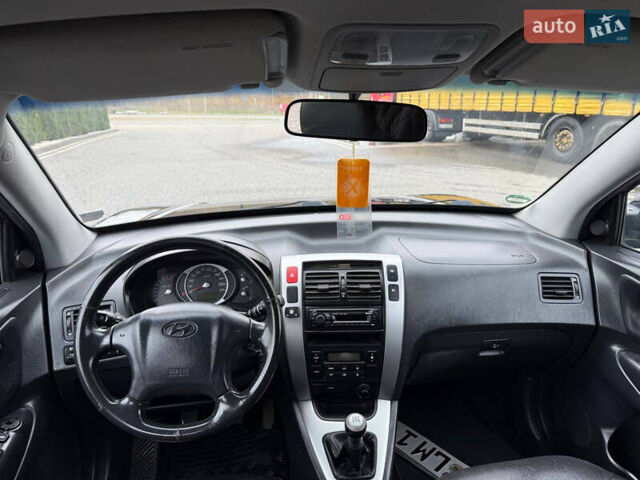 Черный Хендай Туксон, объемом двигателя 1.98 л и пробегом 205 тыс. км за 7950 $, фото 17 на Automoto.ua