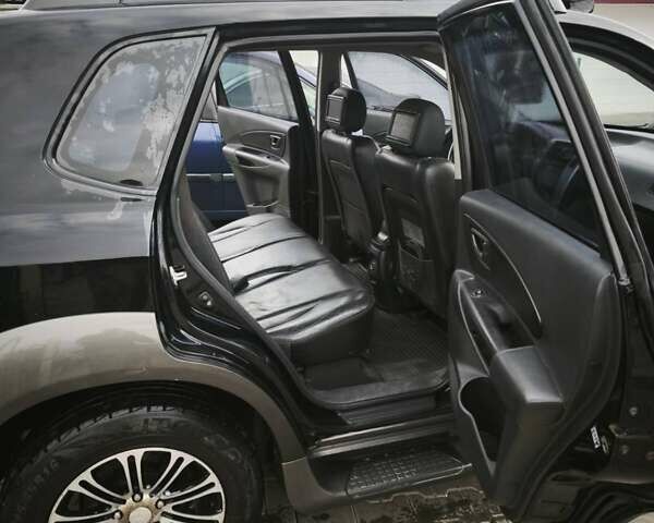 Черный Хендай Туксон, объемом двигателя 1.98 л и пробегом 189 тыс. км за 7800 $, фото 13 на Automoto.ua