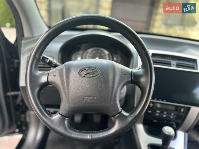 Черный Хендай Туксон, объемом двигателя 2 л и пробегом 218 тыс. км за 8700 $, фото 36 на Automoto.ua