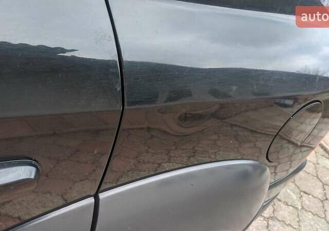 Черный Хендай Туксон, объемом двигателя 2 л и пробегом 163 тыс. км за 8100 $, фото 11 на Automoto.ua