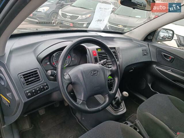 Черный Хендай Туксон, объемом двигателя 2 л и пробегом 192 тыс. км за 7990 $, фото 18 на Automoto.ua