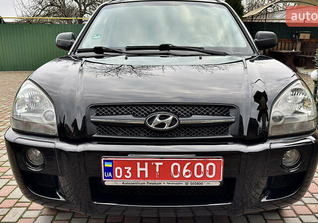 Чорний Хендай Туксон, об'ємом двигуна 2 л та пробігом 182 тис. км за 8299 $, фото 39 на Automoto.ua