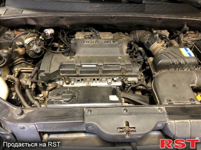 Черный Хендай Туксон, объемом двигателя 2 л и пробегом 220 тыс. км за 8000 $, фото 8 на Automoto.ua