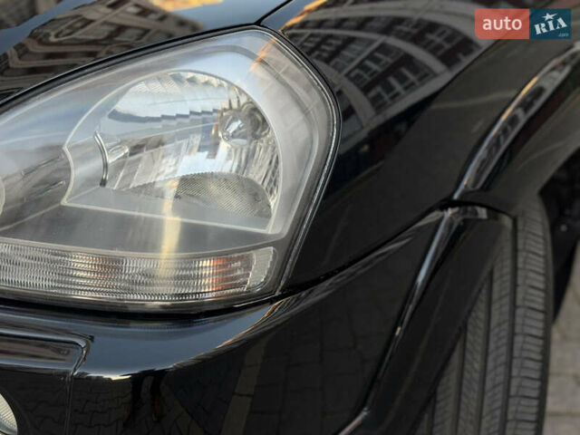 Чорний Хендай Туксон, об'ємом двигуна 2 л та пробігом 156 тис. км за 7850 $, фото 49 на Automoto.ua