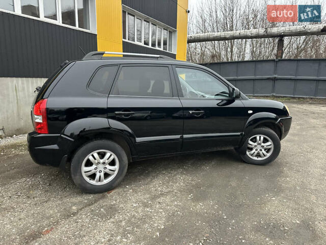 Чорний Хендай Туксон, об'ємом двигуна 2 л та пробігом 243 тис. км за 7999 $, фото 22 на Automoto.ua