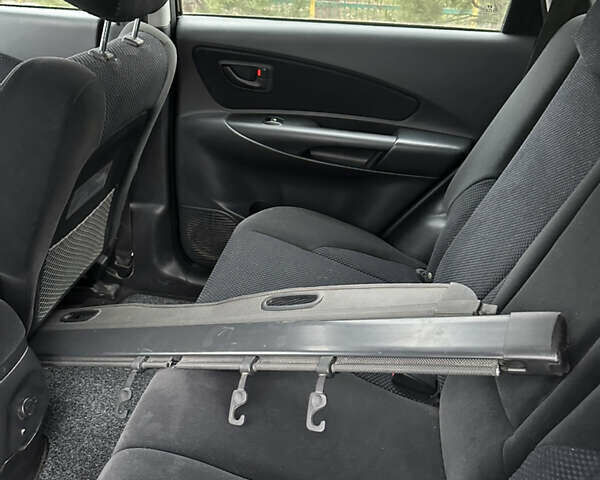 Черный Хендай Туксон, объемом двигателя 2 л и пробегом 136 тыс. км за 8500 $, фото 28 на Automoto.ua