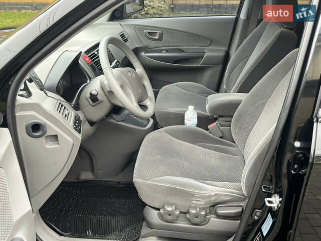 Черный Хендай Туксон, объемом двигателя 2 л и пробегом 107 тыс. км за 8900 $, фото 21 на Automoto.ua