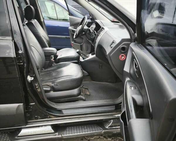 Черный Хендай Туксон, объемом двигателя 1.98 л и пробегом 189 тыс. км за 7800 $, фото 17 на Automoto.ua