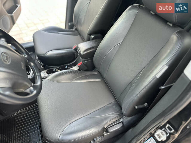 Черный Хендай Туксон, объемом двигателя 2 л и пробегом 218 тыс. км за 8700 $, фото 31 на Automoto.ua