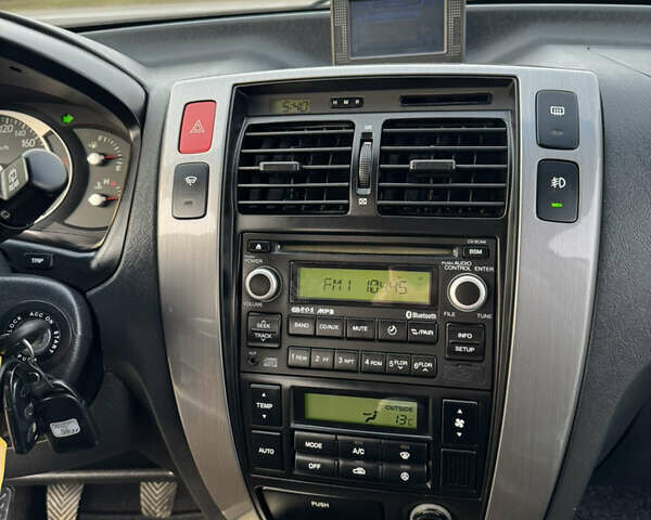 Черный Хендай Туксон, объемом двигателя 2 л и пробегом 210 тыс. км за 7850 $, фото 30 на Automoto.ua