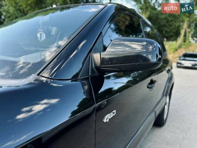 Черный Хендай Туксон, объемом двигателя 1.98 л и пробегом 206 тыс. км за 8300 $, фото 6 на Automoto.ua