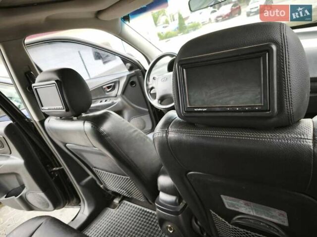 Черный Хендай Туксон, объемом двигателя 1.98 л и пробегом 189 тыс. км за 7800 $, фото 15 на Automoto.ua