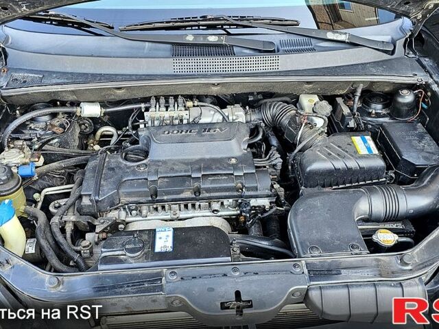 Черный Хендай Туксон, объемом двигателя 2 л и пробегом 215 тыс. км за 8350 $, фото 4 на Automoto.ua