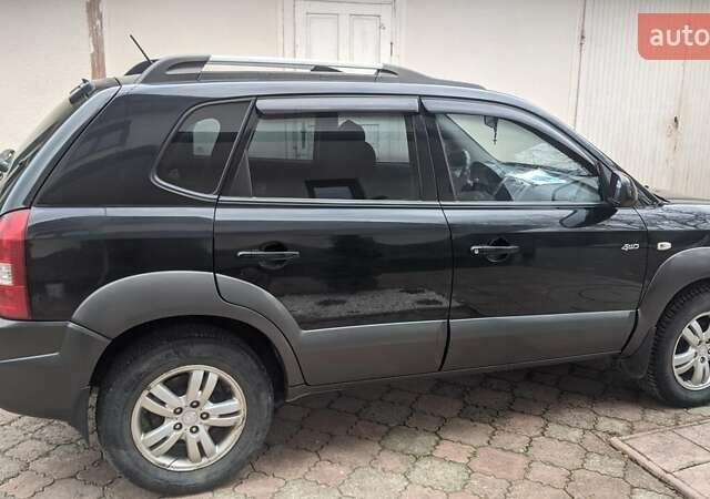 Черный Хендай Туксон, объемом двигателя 2 л и пробегом 163 тыс. км за 8100 $, фото 19 на Automoto.ua