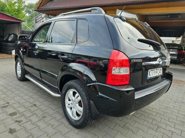 Черный Хендай Туксон, объемом двигателя 2 л и пробегом 287 тыс. км за 2400 $, фото 3 на Automoto.ua