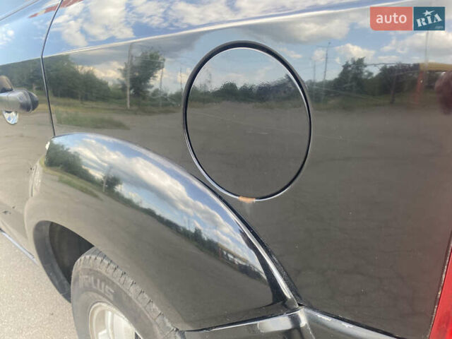Черный Хендай Туксон, объемом двигателя 2 л и пробегом 270 тыс. км за 7300 $, фото 11 на Automoto.ua
