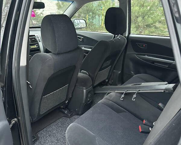 Черный Хендай Туксон, объемом двигателя 2 л и пробегом 136 тыс. км за 8500 $, фото 26 на Automoto.ua