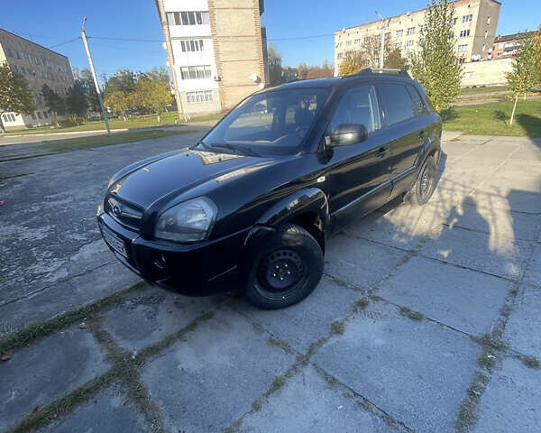 Черный Хендай Туксон, объемом двигателя 1.98 л и пробегом 262 тыс. км за 7900 $, фото 11 на Automoto.ua