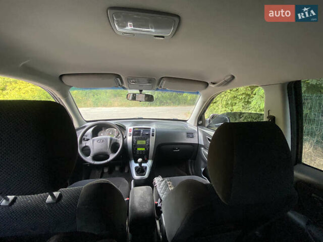 Чорний Хендай Туксон, об'ємом двигуна 2 л та пробігом 201 тис. км за 7800 $, фото 5 на Automoto.ua
