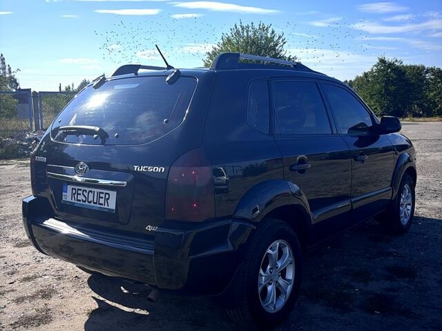 Черный Хендай Туксон, объемом двигателя 2 л и пробегом 193 тыс. км за 7900 $, фото 2 на Automoto.ua