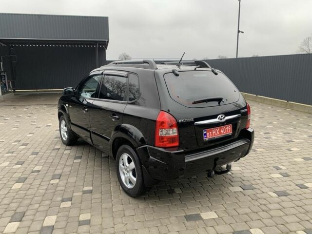Черный Хендай Туксон, объемом двигателя 2 л и пробегом 198 тыс. км за 7500 $, фото 3 на Automoto.ua