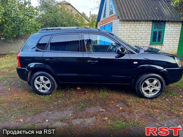 Черный Хендай Туксон, объемом двигателя 2 л и пробегом 187 тыс. км за 7900 $, фото 3 на Automoto.ua