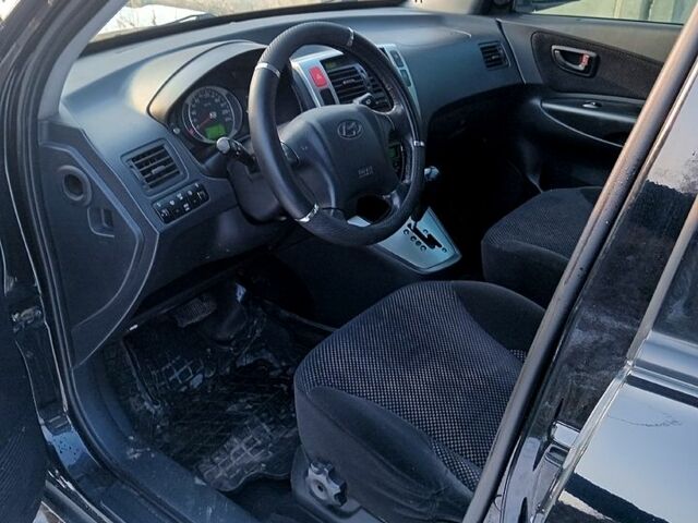 Черный Хендай Туксон, объемом двигателя 2 л и пробегом 227 тыс. км за 8400 $, фото 4 на Automoto.ua
