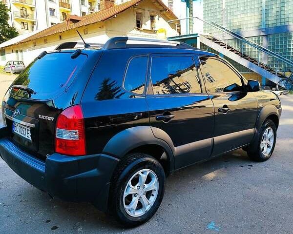 Черный Хендай Туксон, объемом двигателя 1.98 л и пробегом 330 тыс. км за 8200 $, фото 7 на Automoto.ua