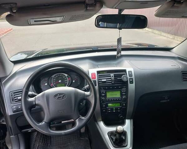 Черный Хендай Туксон, объемом двигателя 2 л и пробегом 168 тыс. км за 9000 $, фото 22 на Automoto.ua