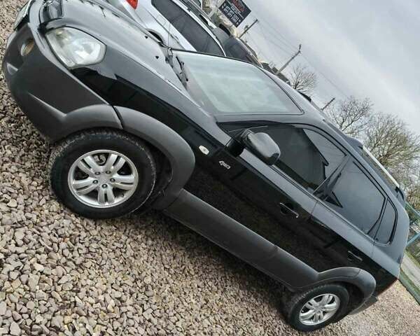 Чорний Хендай Туксон, об'ємом двигуна 2 л та пробігом 185 тис. км за 7499 $, фото 24 на Automoto.ua