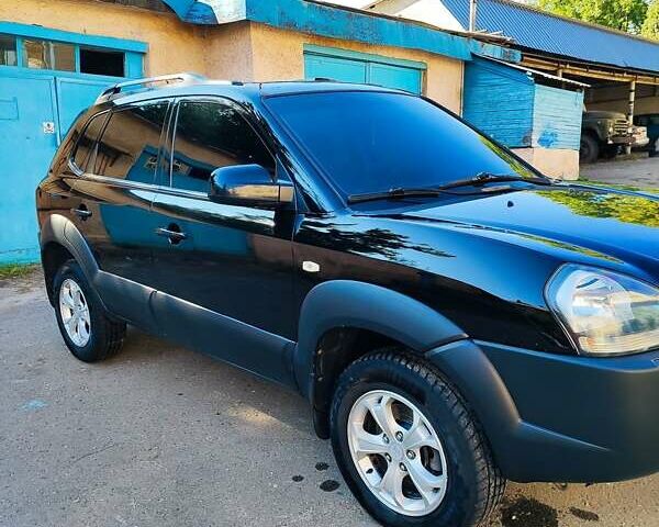 Черный Хендай Туксон, объемом двигателя 1.98 л и пробегом 330 тыс. км за 8200 $, фото 9 на Automoto.ua