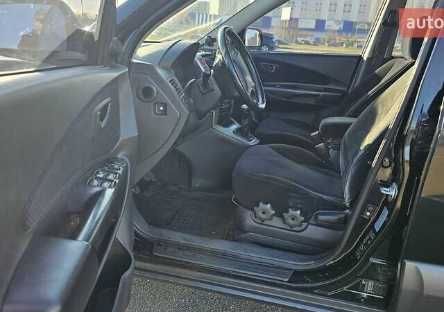 Чорний Хендай Туксон, об'ємом двигуна 1.98 л та пробігом 212 тис. км за 7766 $, фото 10 на Automoto.ua