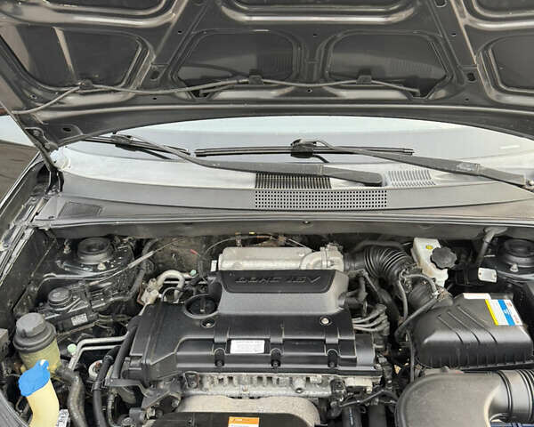 Черный Хендай Туксон, объемом двигателя 2 л и пробегом 210 тыс. км за 7850 $, фото 40 на Automoto.ua