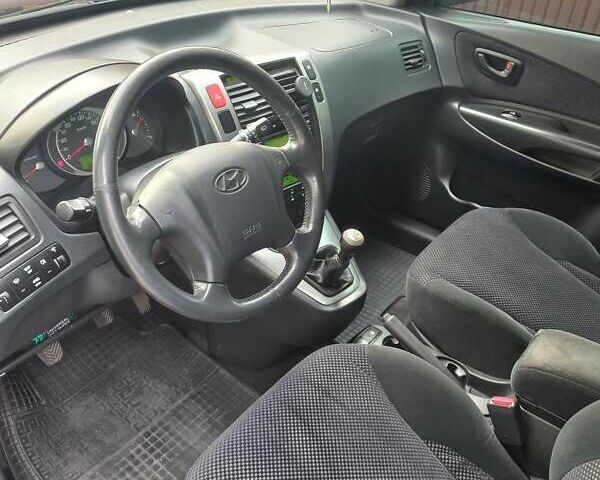 Черный Хендай Туксон, объемом двигателя 2 л и пробегом 168 тыс. км за 9000 $, фото 23 на Automoto.ua