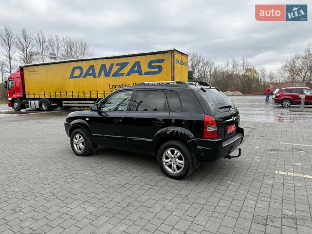 Черный Хендай Туксон, объемом двигателя 1.98 л и пробегом 205 тыс. км за 7950 $, фото 5 на Automoto.ua