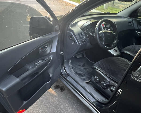 Черный Хендай Туксон, объемом двигателя 2.66 л и пробегом 256 тыс. км за 7600 $, фото 5 на Automoto.ua