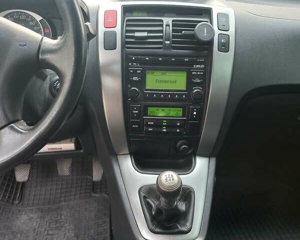 Черный Хендай Туксон, объемом двигателя 2 л и пробегом 168 тыс. км за 9000 $, фото 26 на Automoto.ua