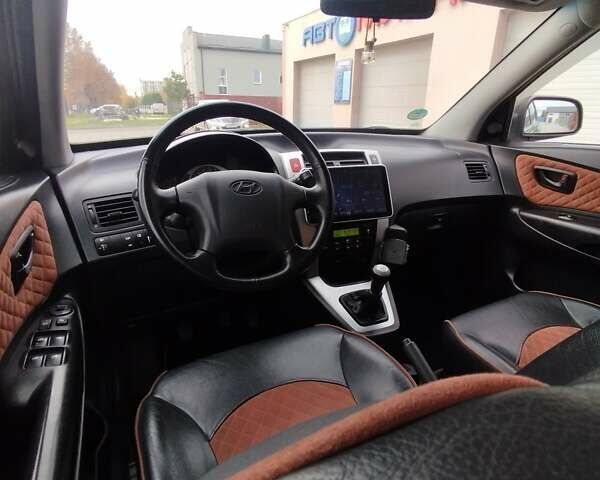 Черный Хендай Туксон, объемом двигателя 1.98 л и пробегом 214 тыс. км за 7700 $, фото 19 на Automoto.ua