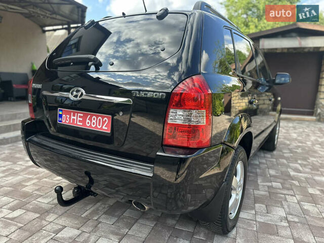 Черный Хендай Туксон, объемом двигателя 2 л и пробегом 218 тыс. км за 8700 $, фото 14 на Automoto.ua