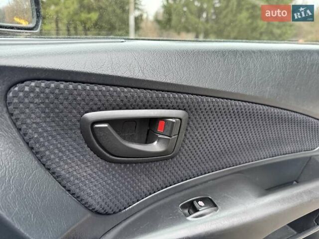 Черный Хендай Туксон, объемом двигателя 1.99 л и пробегом 240 тыс. км за 7200 $, фото 28 на Automoto.ua