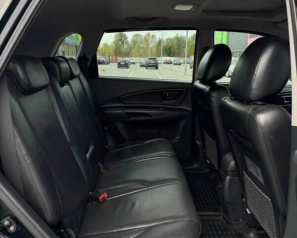 Черный Хендай Туксон, объемом двигателя 1.98 л и пробегом 202 тыс. км за 8350 $, фото 1 на Automoto.ua