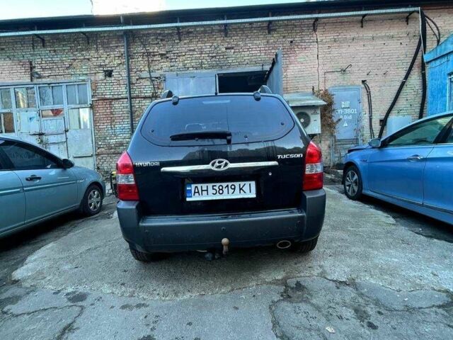 Черный Хендай Туксон, объемом двигателя 2 л и пробегом 220 тыс. км за 7000 $, фото 1 на Automoto.ua