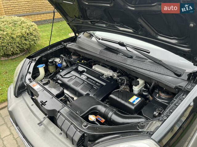 Черный Хендай Туксон, объемом двигателя 2 л и пробегом 107 тыс. км за 8900 $, фото 16 на Automoto.ua