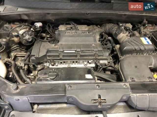 Чорний Хендай Туксон, об'ємом двигуна 1.98 л та пробігом 220 тис. км за 8000 $, фото 10 на Automoto.ua