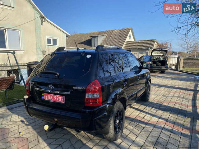 Черный Хендай Туксон, объемом двигателя 2 л и пробегом 149 тыс. км за 8250 $, фото 5 на Automoto.ua