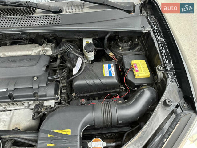 Черный Хендай Туксон, объемом двигателя 2 л и пробегом 136 тыс. км за 8500 $, фото 38 на Automoto.ua