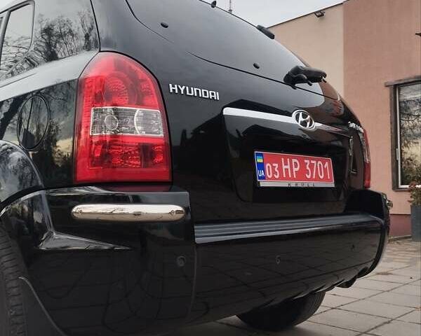 Черный Хендай Туксон, объемом двигателя 1.98 л и пробегом 214 тыс. км за 7700 $, фото 9 на Automoto.ua