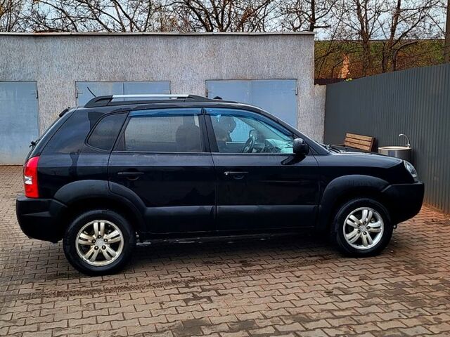 Черный Хендай Туксон, объемом двигателя 2 л и пробегом 223 тыс. км за 7500 $, фото 10 на Automoto.ua