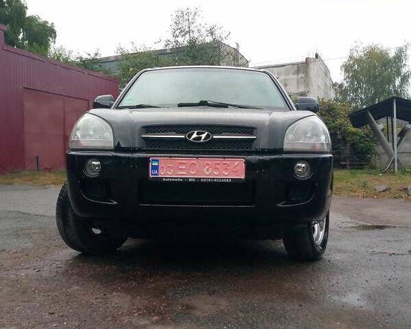 Чорний Хендай Туксон, об'ємом двигуна 2 л та пробігом 225 тис. км за 7850 $, фото 5 на Automoto.ua